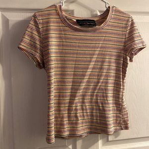This is a multicolored shirt from Polly Esther. It is a small